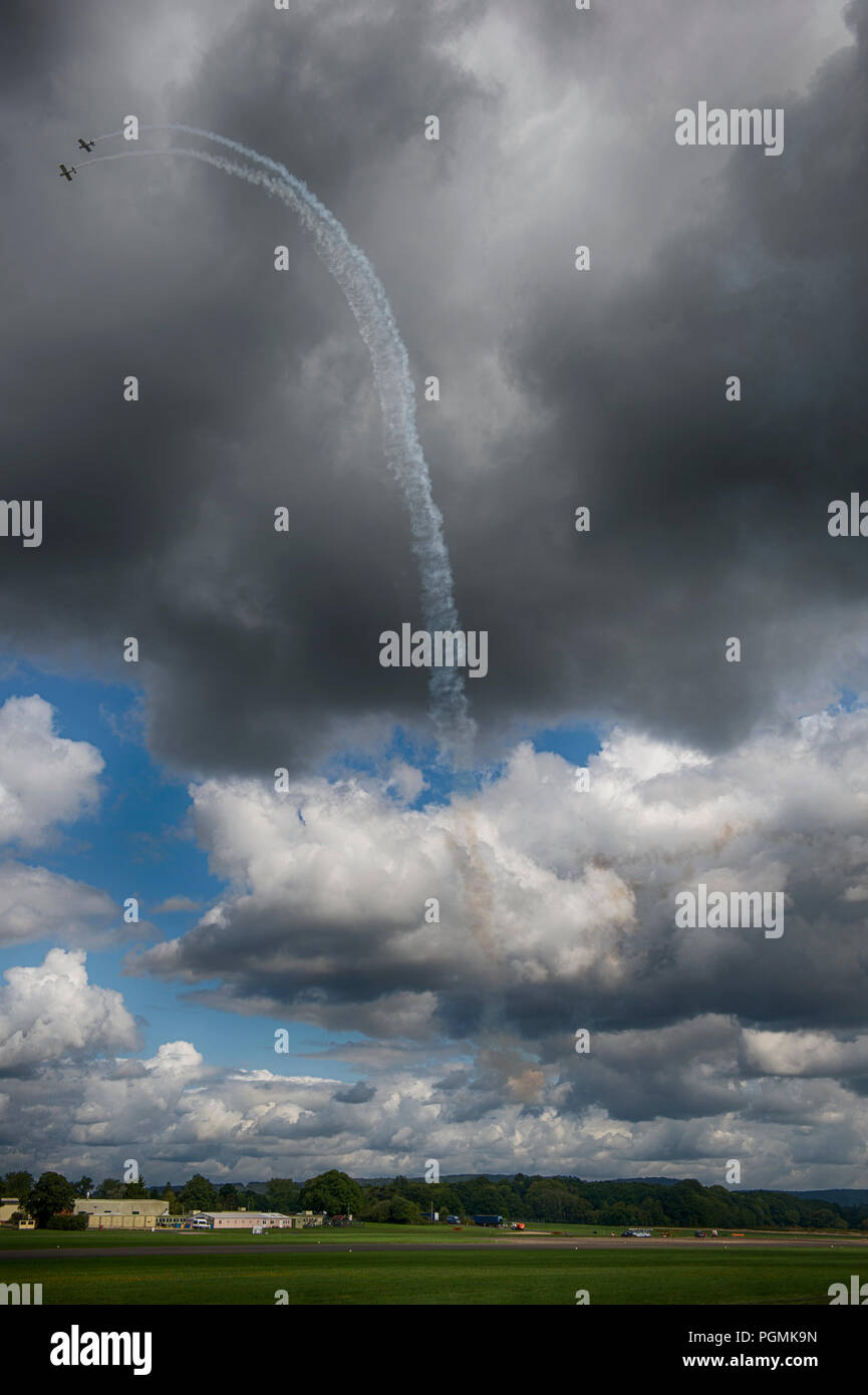 Surrey, UK. Fireflies Aerobatics Display Team flying display at 2018 Dunsfold Wings and Wheels. Credit: Malcolm Park/Alamy. Stock Photo