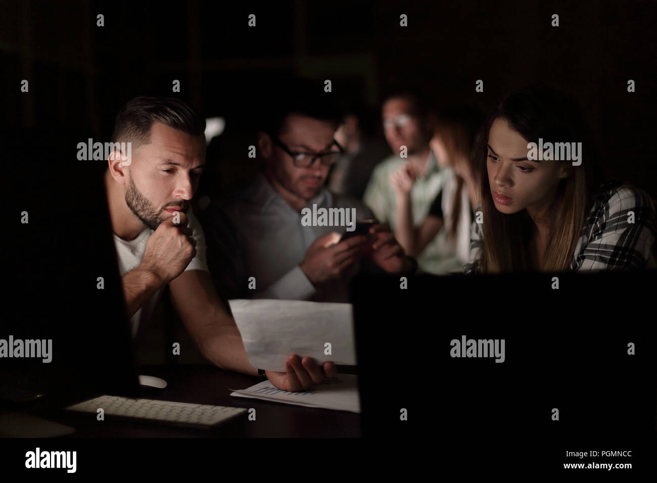 business team uses gadgets to solve the problem Stock Photo
