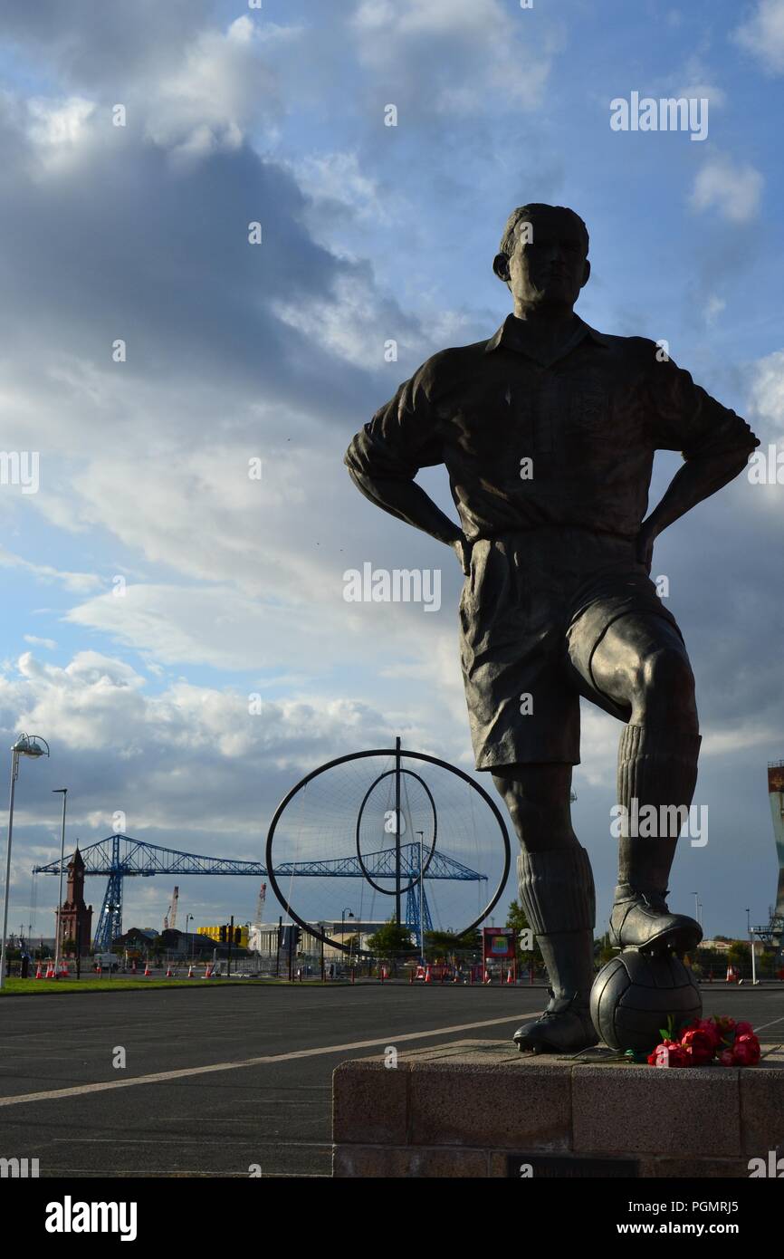 Naturally lit, moody image of statues outside the Riverside Stadium