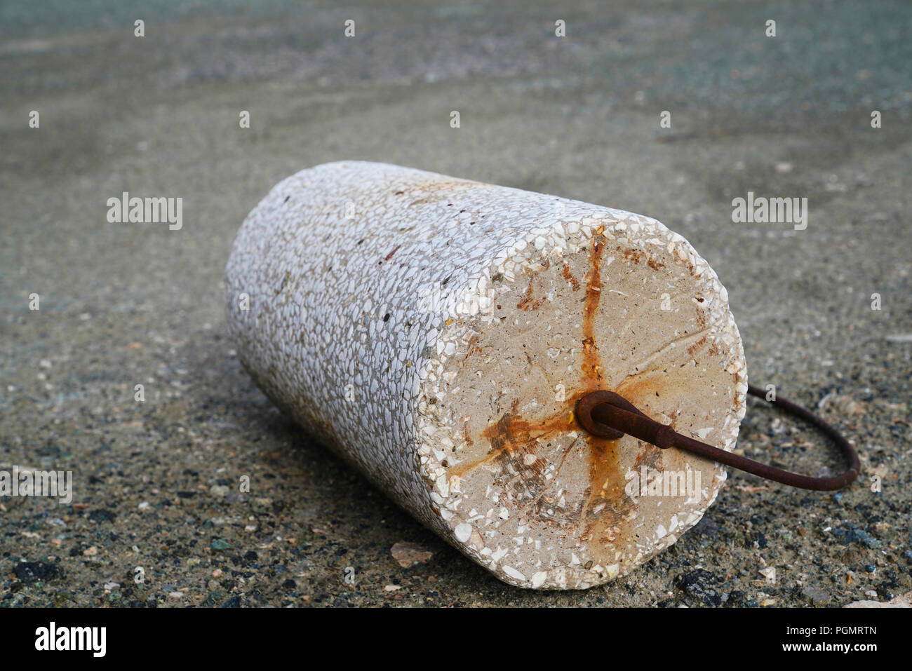 Stone roller to compress the flat roof of earthsheltered home not to