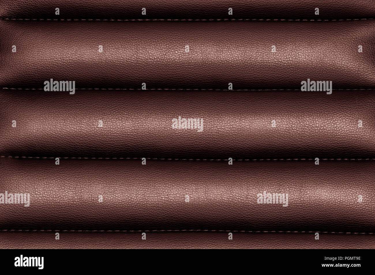 Burgundy wavy leather background with seams Stock Photo