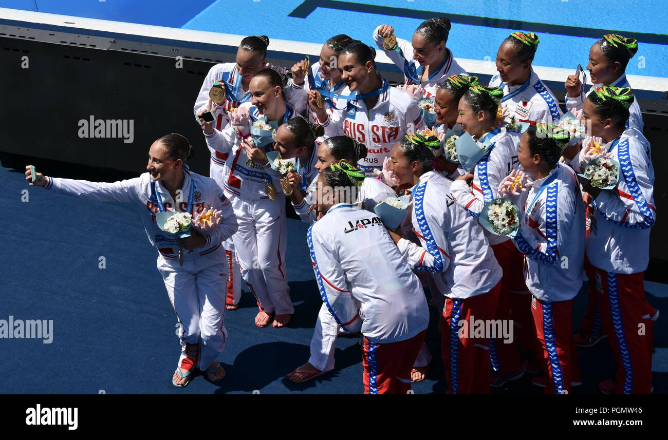 Budapest, Hungary - Jul 18, 2017. Synchronized swimming teams (Japan, China and Russia) taking selfie after the Victory Ceremony of Team Technical. FI Stock Photo