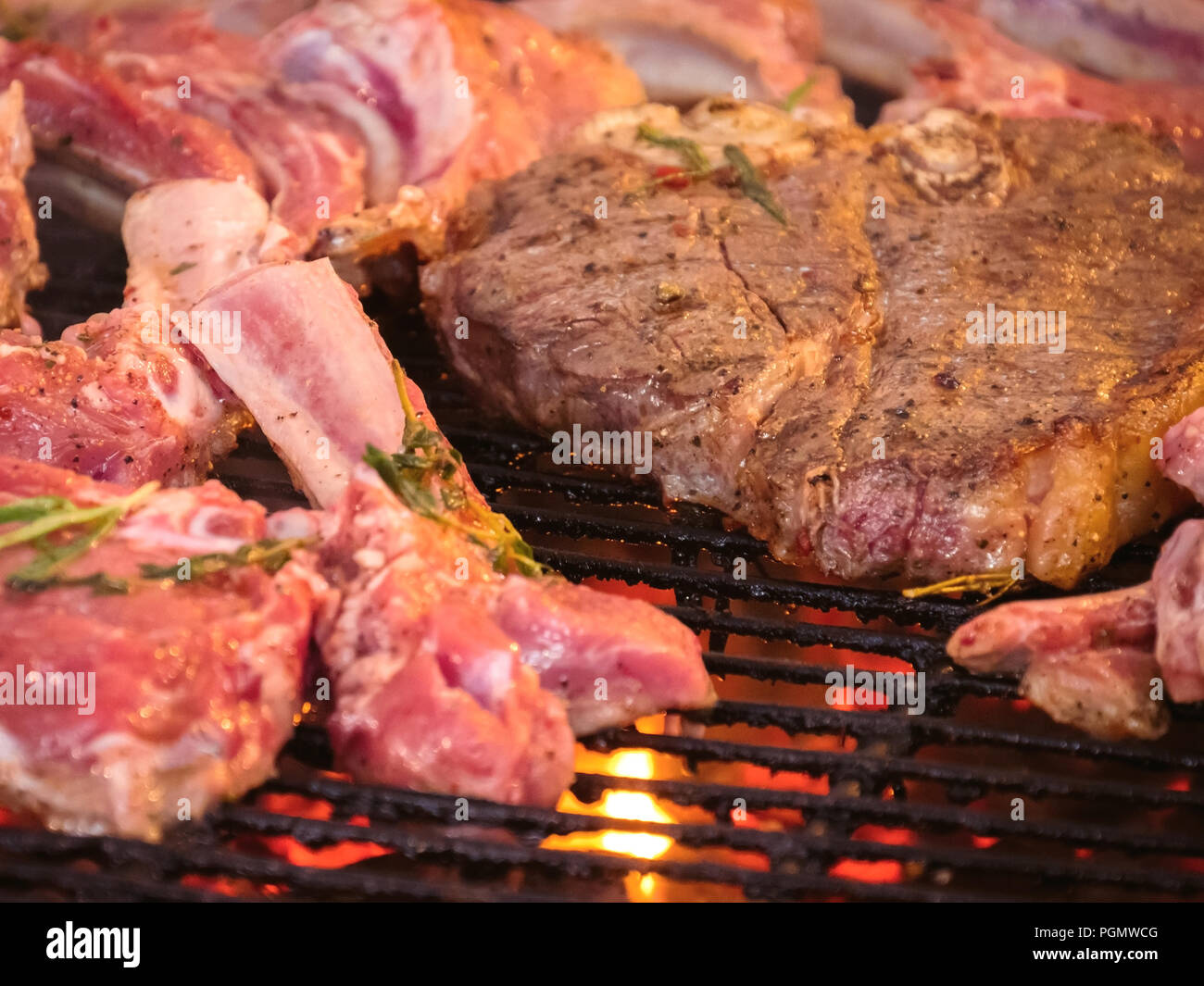 Grilled steak. Ribs on grill. Close up. Stock Photo