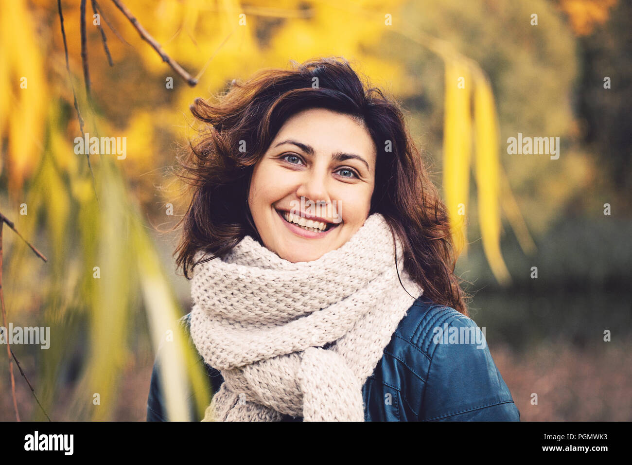 Autumn portrait of cute smiling woman outdoors Stock Photo - Alamy