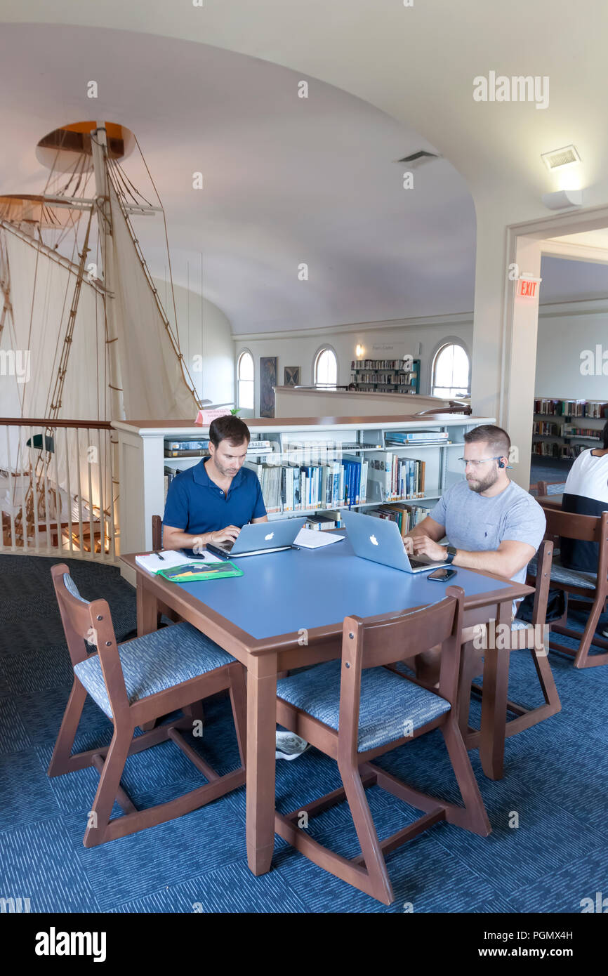 Adults using laptop computers in the Provincetown, Massachusetts public library. Stock Photo