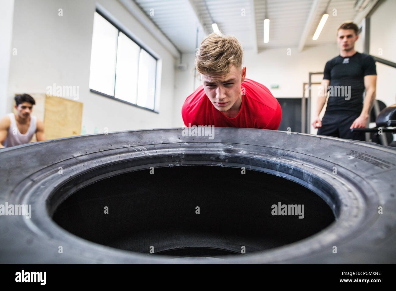 Man flipping tire hi-res stock photography and images - Alamy