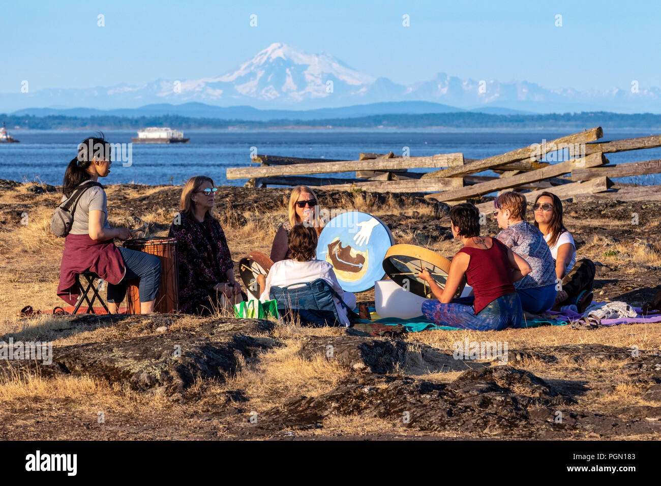 Drum circle at Cattle Point in Uplands Park, Oak Bay near Victoria, Vancouver Island, British Columbia, Canada Stock Photo
