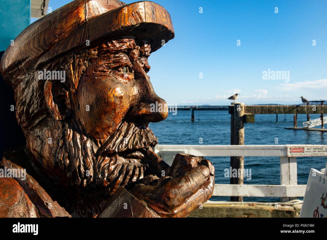 Wood carving of old Fisherman Sidney, Vancouver Island, British