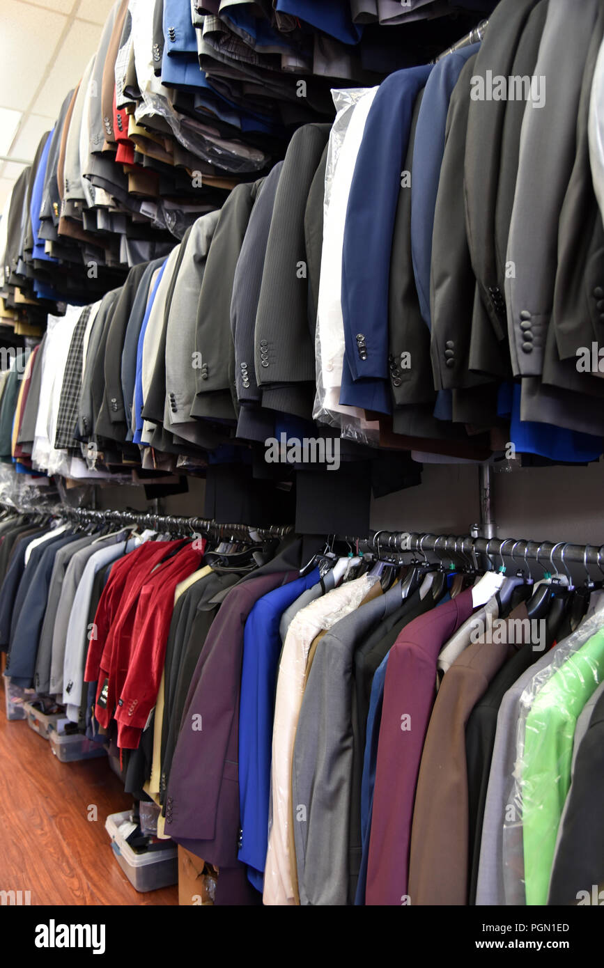 Rows of men’s suits hang in a clothing store Stock Photo Alamy