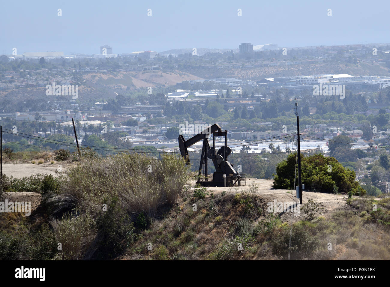An oil pump jack operating in one of the many Los Angeles Oil Fields