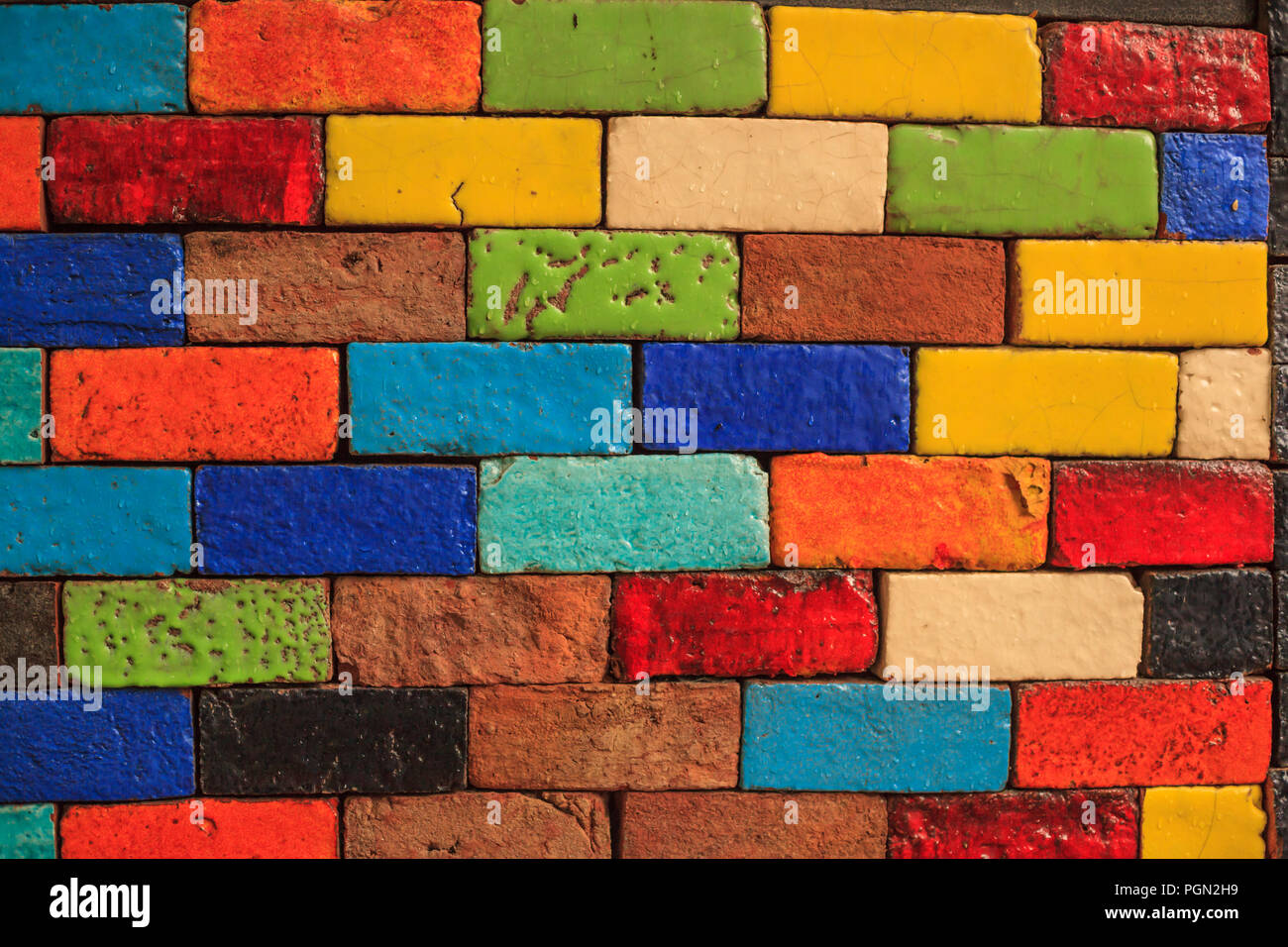 abstract aged multicolored painted baked earthen clay brick blocks,  colorful architectural structure design, exterior wall background, wallpaper,  back Stock Photo - Alamy