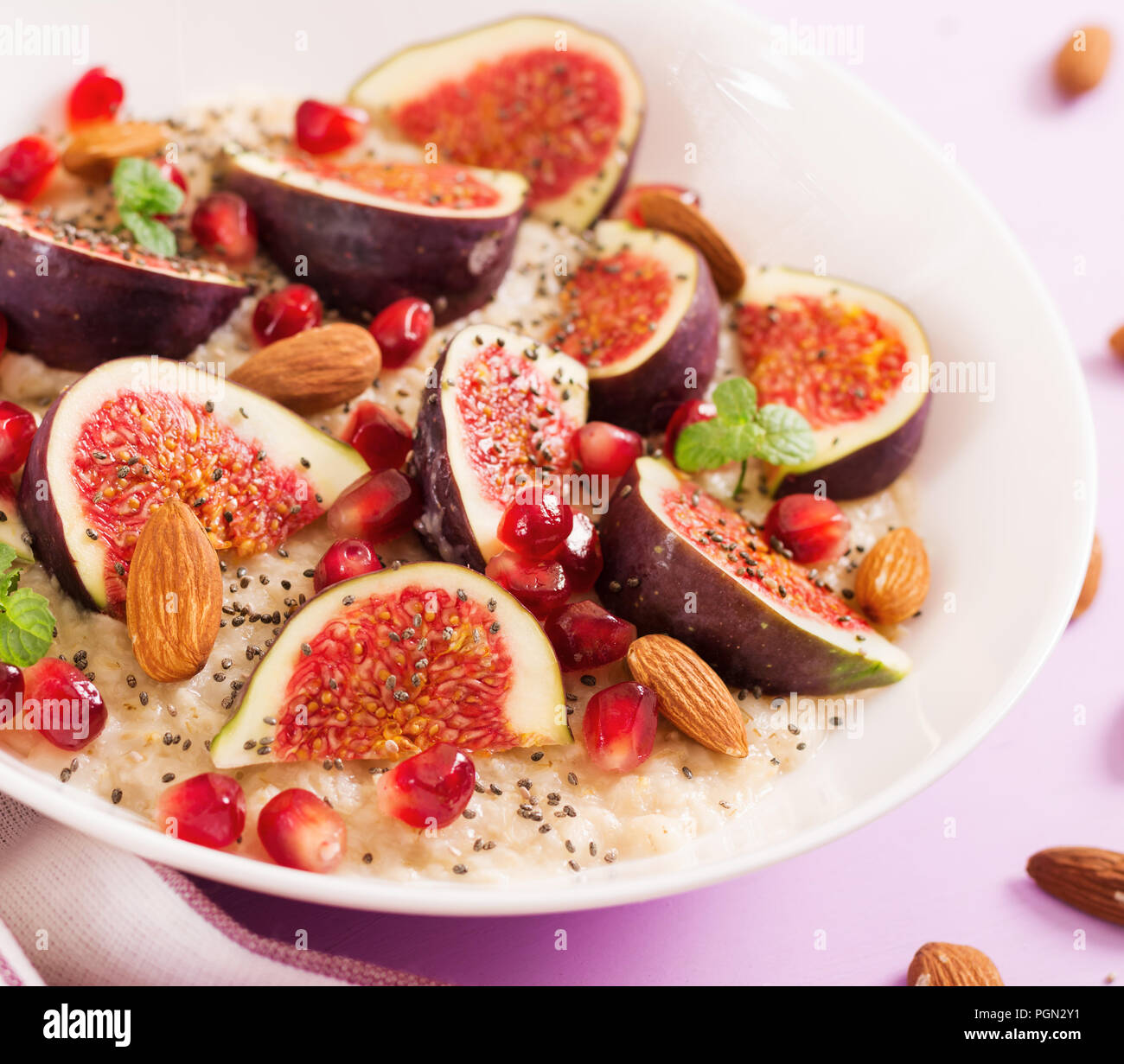 Delicious and healthy oatmeal with figs, almond and chia seeds. Healthy