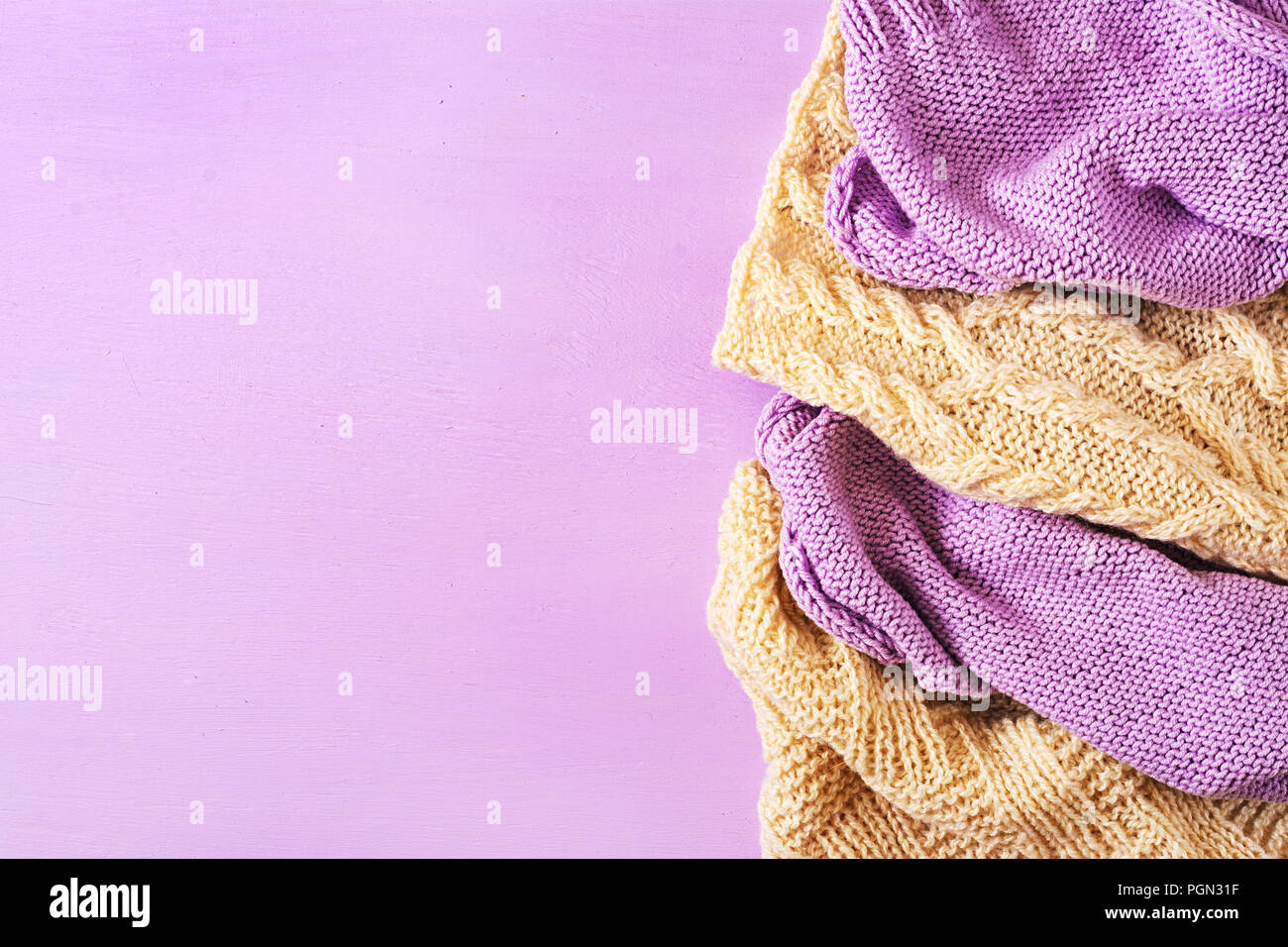 Violet white wool knitting texture.  Sweater textile background. Top view. Flat lay Stock Photo