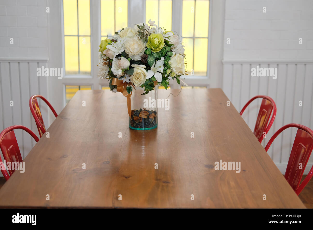 wood table & red chair set in cozy dining room interior Stock Photo Alamy