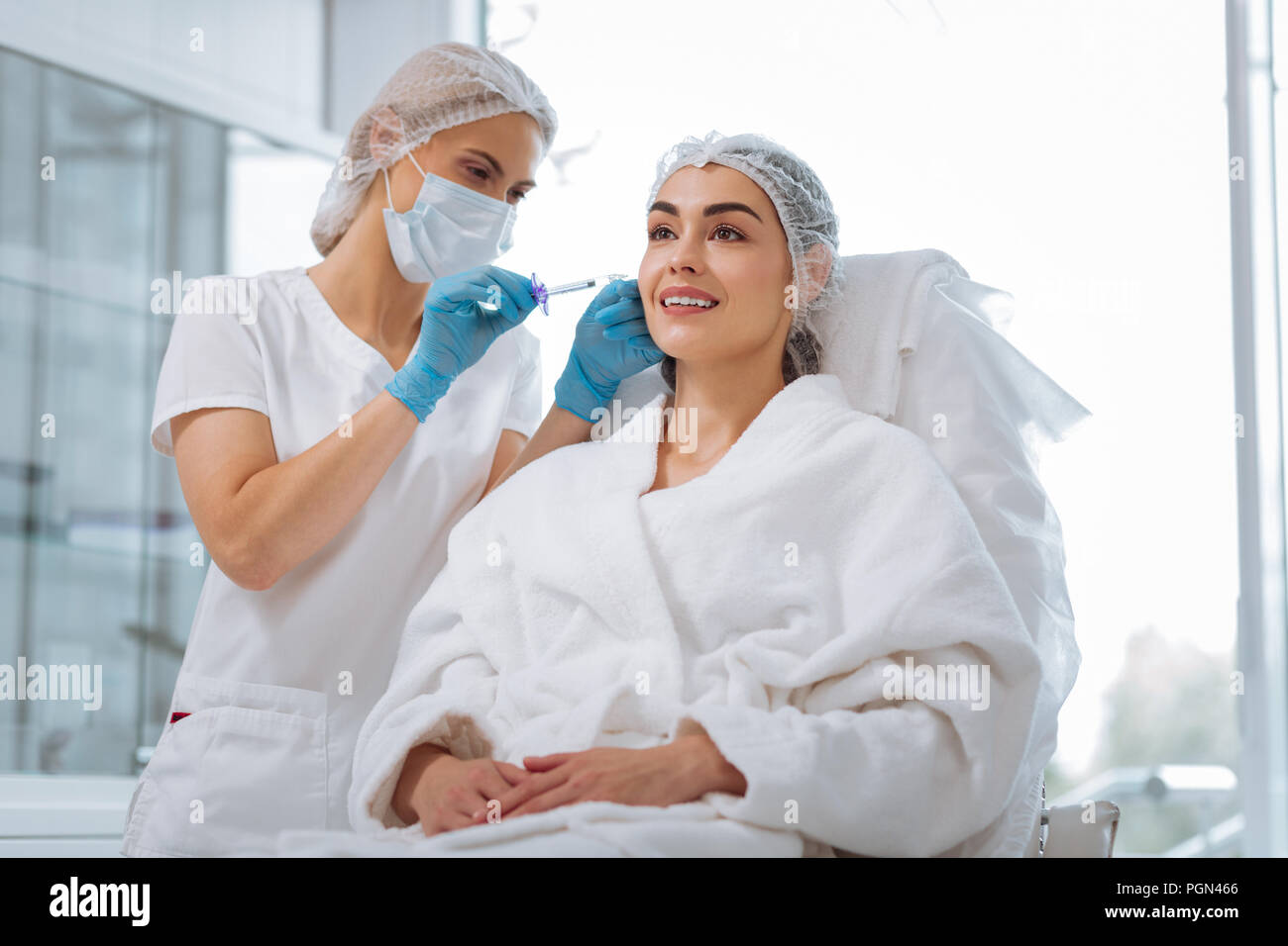 Delighted positive good looking woman having an injection Stock Photo ...