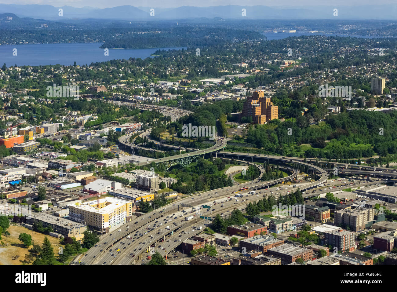 Aerial view of the Interstate 5 expressway in Seattle, the International District, Atlantic, North Beacon Hill, Mt Baker and Lake Washington, USA. Stock Photo