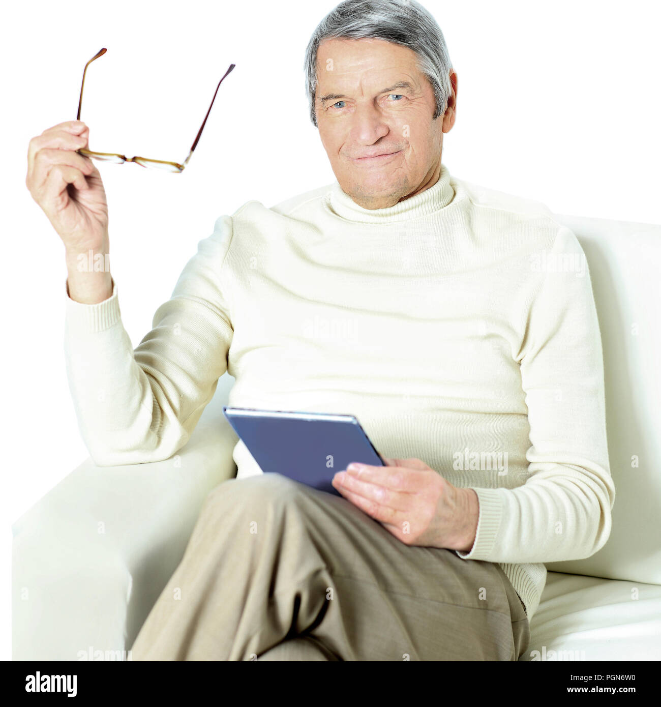 Senior man relaxing at home with in the book Stock Photo - Alamy