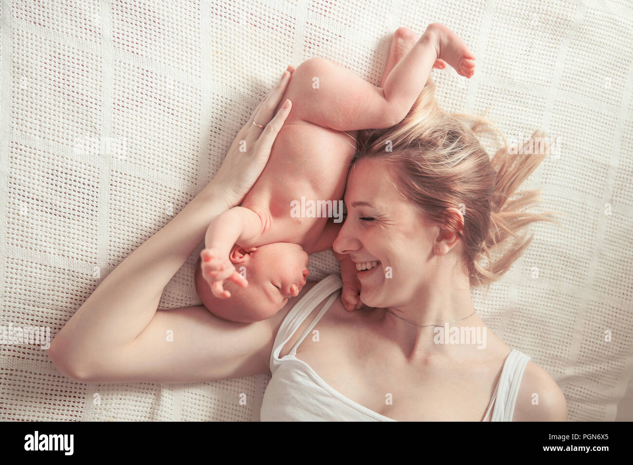 happy motherhood concept - happy mother and newborn baby Stock Photo