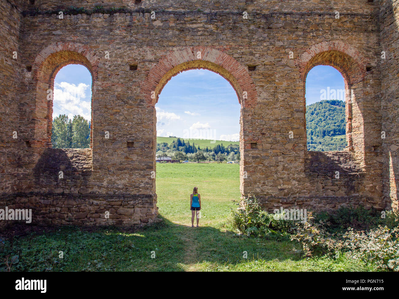 A traveler standing in a ruined arc, Orava, Slovakia. Stock Photo