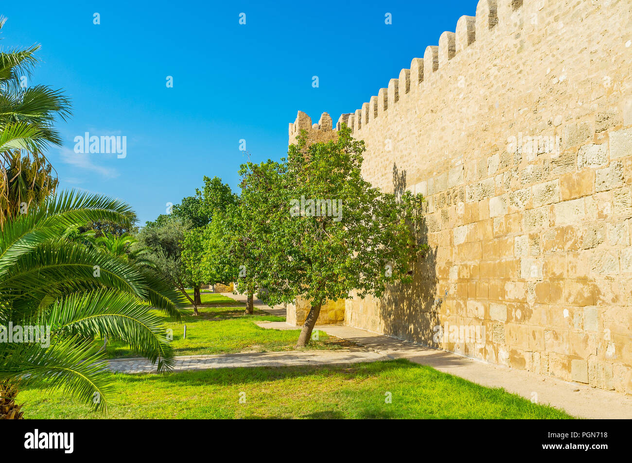 The old Medina of Sousse is surrounded by massive rampart with scenic green garden next to it, Tunisia. Stock Photo