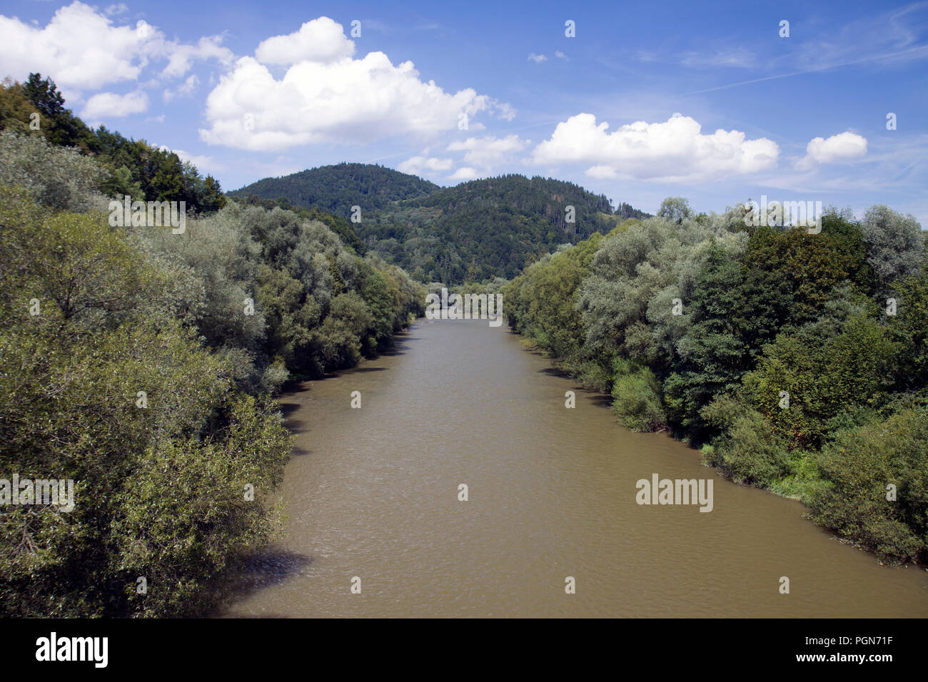 Broad river surrounded by hills, Orava, Slovakia. Stock Photo