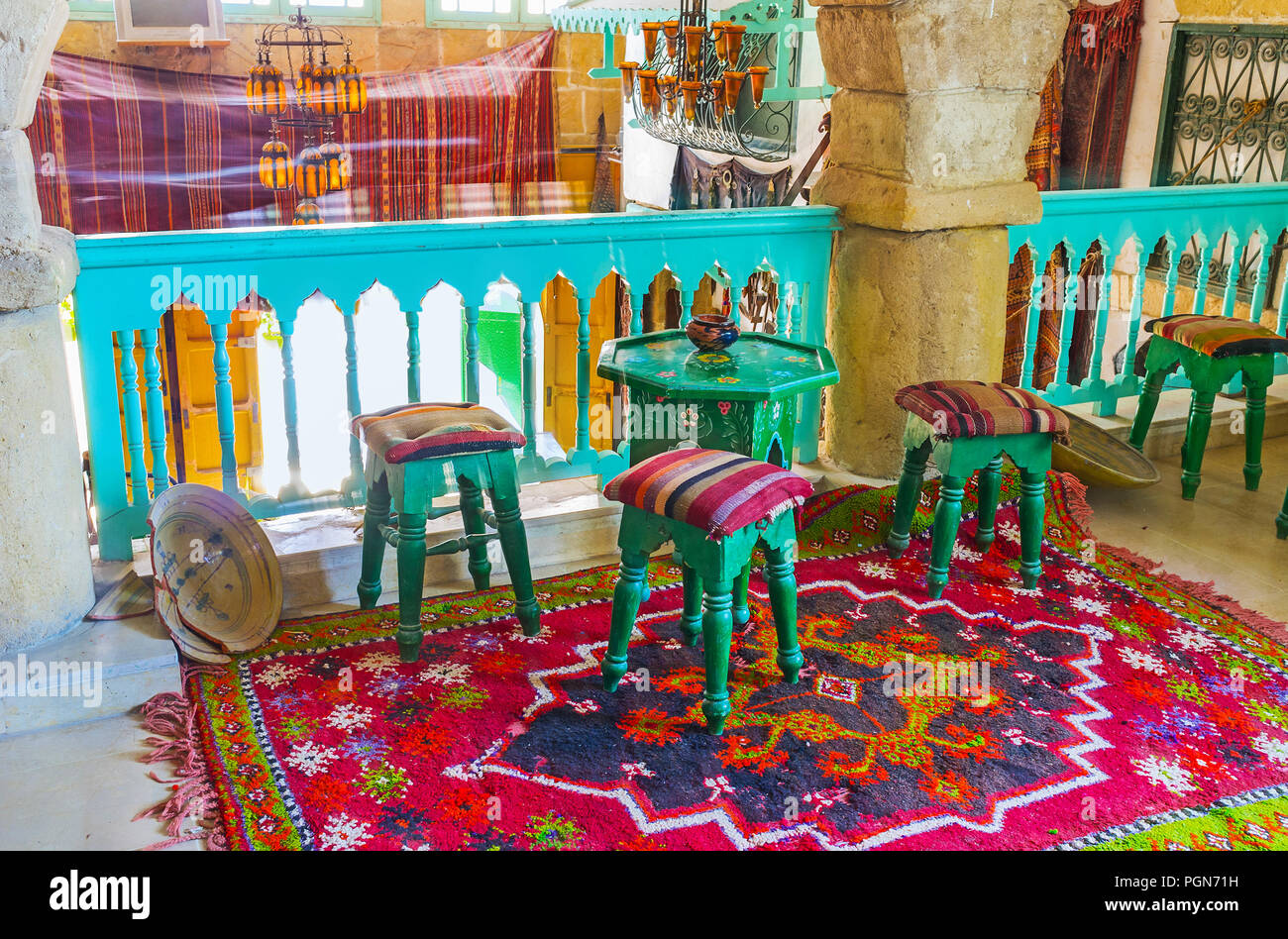 SOUSSE, TUNISIA - SEPTEMBER 1, 2015: Interior of authentic Tunisian restaurant and teahouse with glass vintage chandeliers, carved wooden furniture an Stock Photo