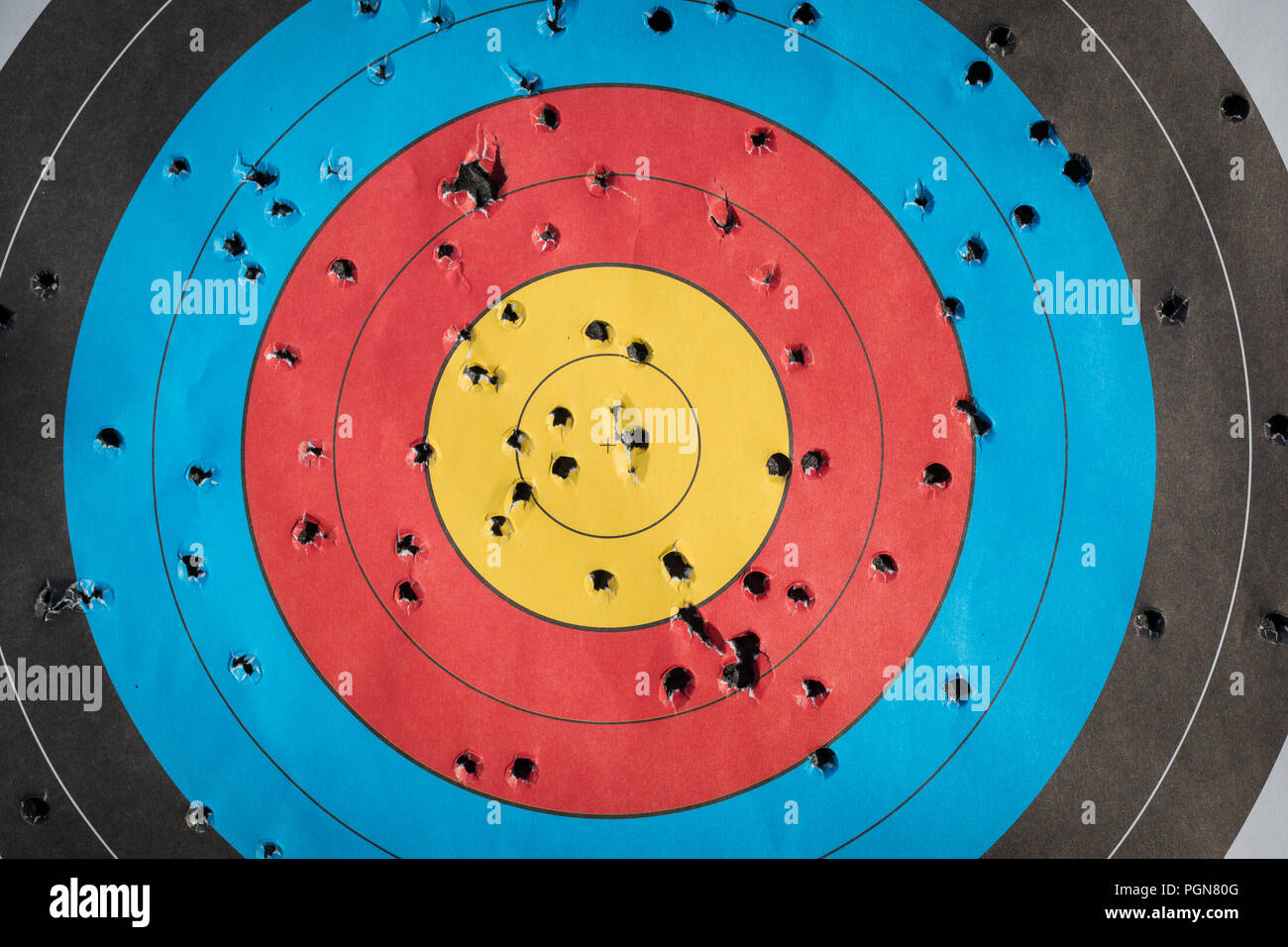 Practice target used for shooting with bullet holes in it, toned Stock Photo