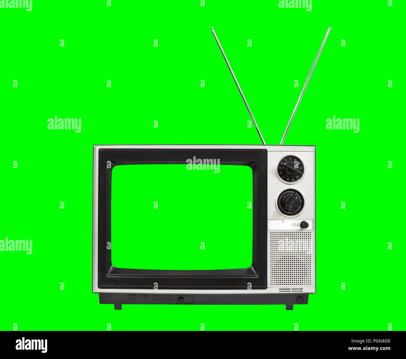 Portable vintage television with antennas and chroma green screen and background. Stock Photo