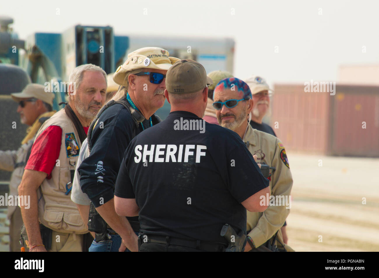 Pershing County law enforcement meeting with members of the Black Rock Rangers as they prepare for the public at the Burning Man Festival as they prepare for attendees to the annual counter culture festival in the desert August 22, 2018 near Black Rock, Nevada. Each year 80,000 of people set up a temporary art city in the middle of the desert. Stock Photo