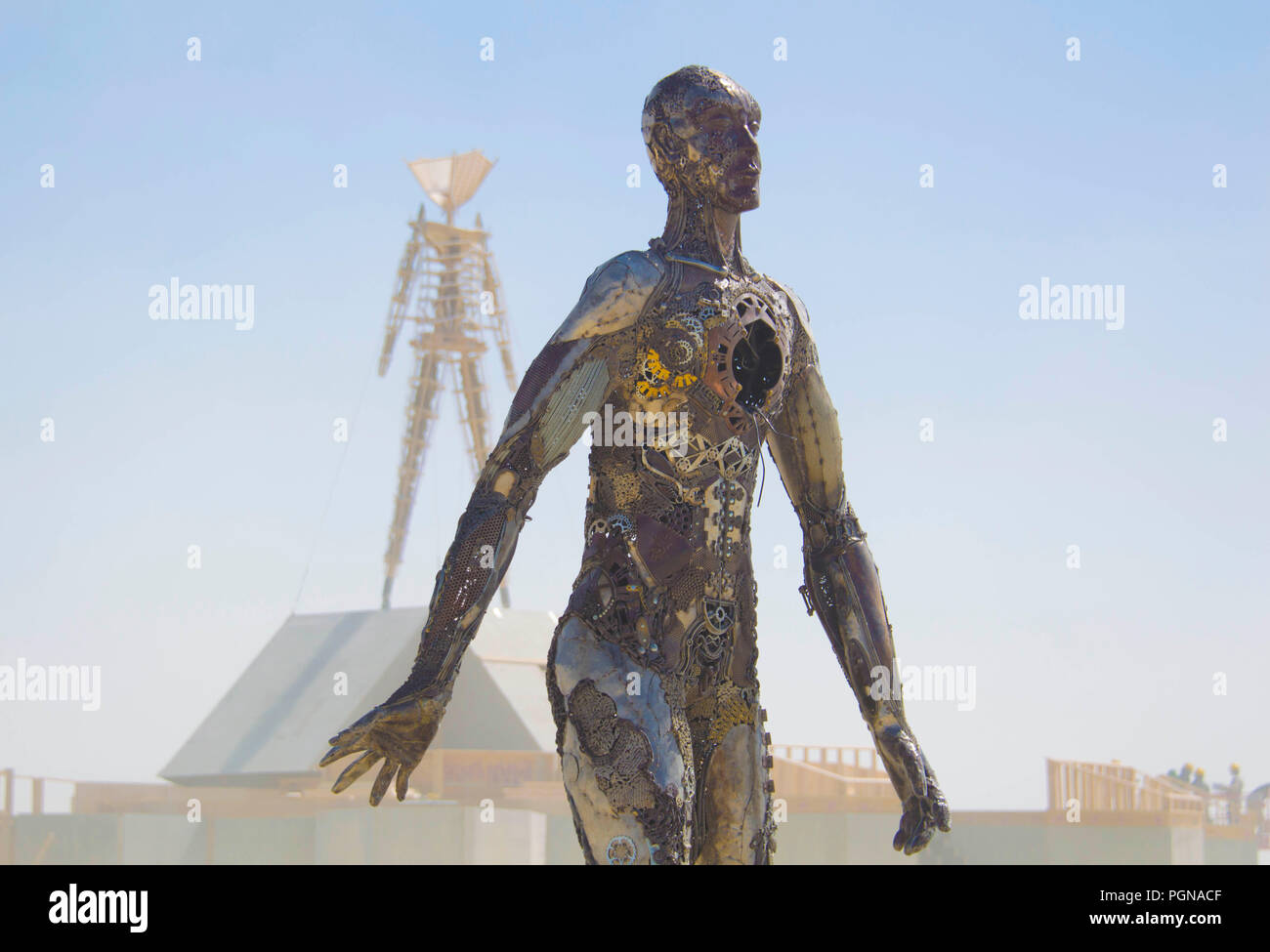 Workers assembly an art installation in preparation at the for attendees at the annual Burning Man counter culture festival in the desert August 23, 2018 near Black Rock, Nevada. Each year 80,000 of people set up a temporary art city in the middle of the desert. Stock Photo