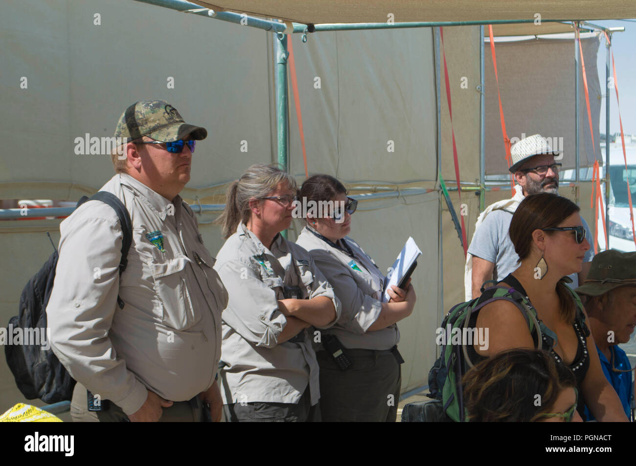 Bureau of Land Management officers meet with the all volunteer Earth Guardians for a pre-event training session on protecting the desert environment at the annual Burning Man counter culture festival in the desert August 23, 2018 near Black Rock, Nevada. Each year 80,000 of people set up a temporary art city in the middle of the desert. Stock Photo