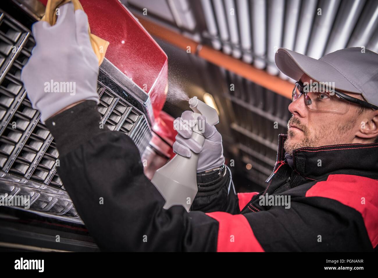 Classic Car Restoration Job. Caucasian Car Collector Cleaning His Newly