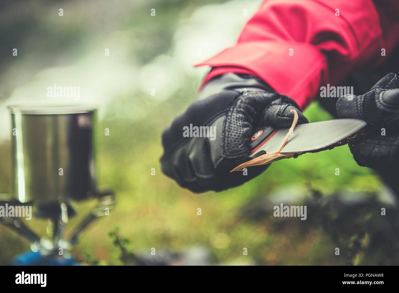 Knife and the Camping. Outdoor Survival Tools Closeup Photo. Stick Sharpening. Stock Photo