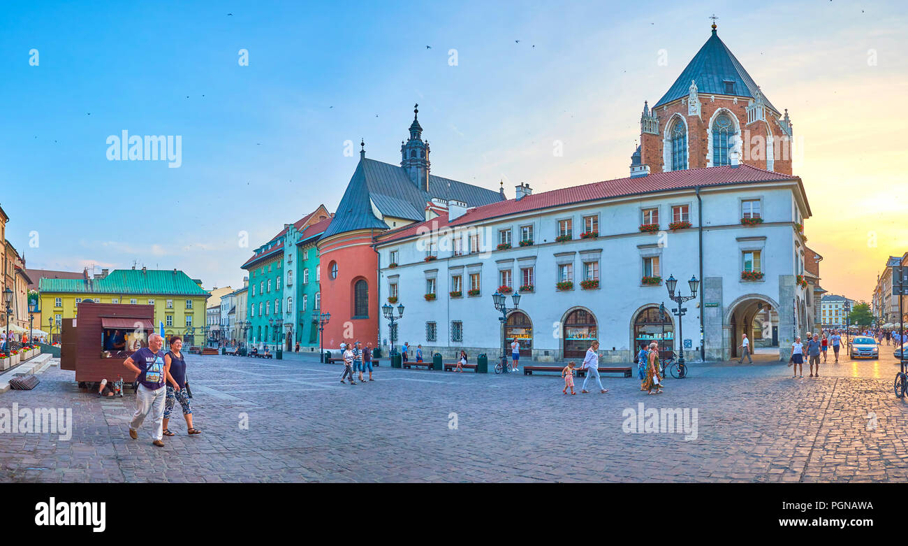 KRAKOW, POLAND - JUNE 11, 2018: Panoramic view on Little Market Square with huge Basilica of St Mary on the background, on June 11 in Krakow Stock Photo