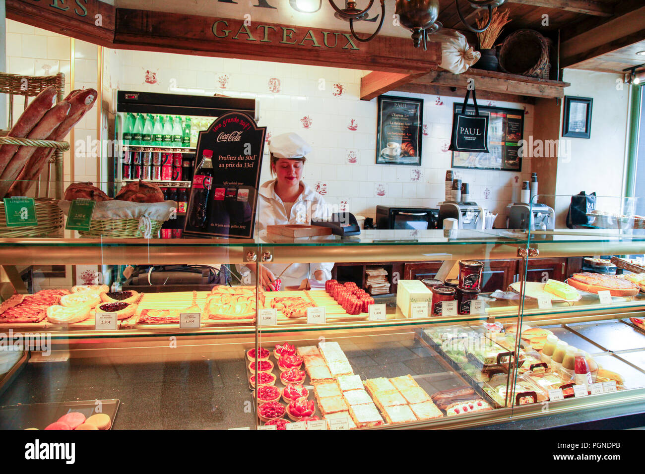 Woman Selling Beautiful Pastries And Croissants In A Patisserie In Reims France Stock Photo Alamy