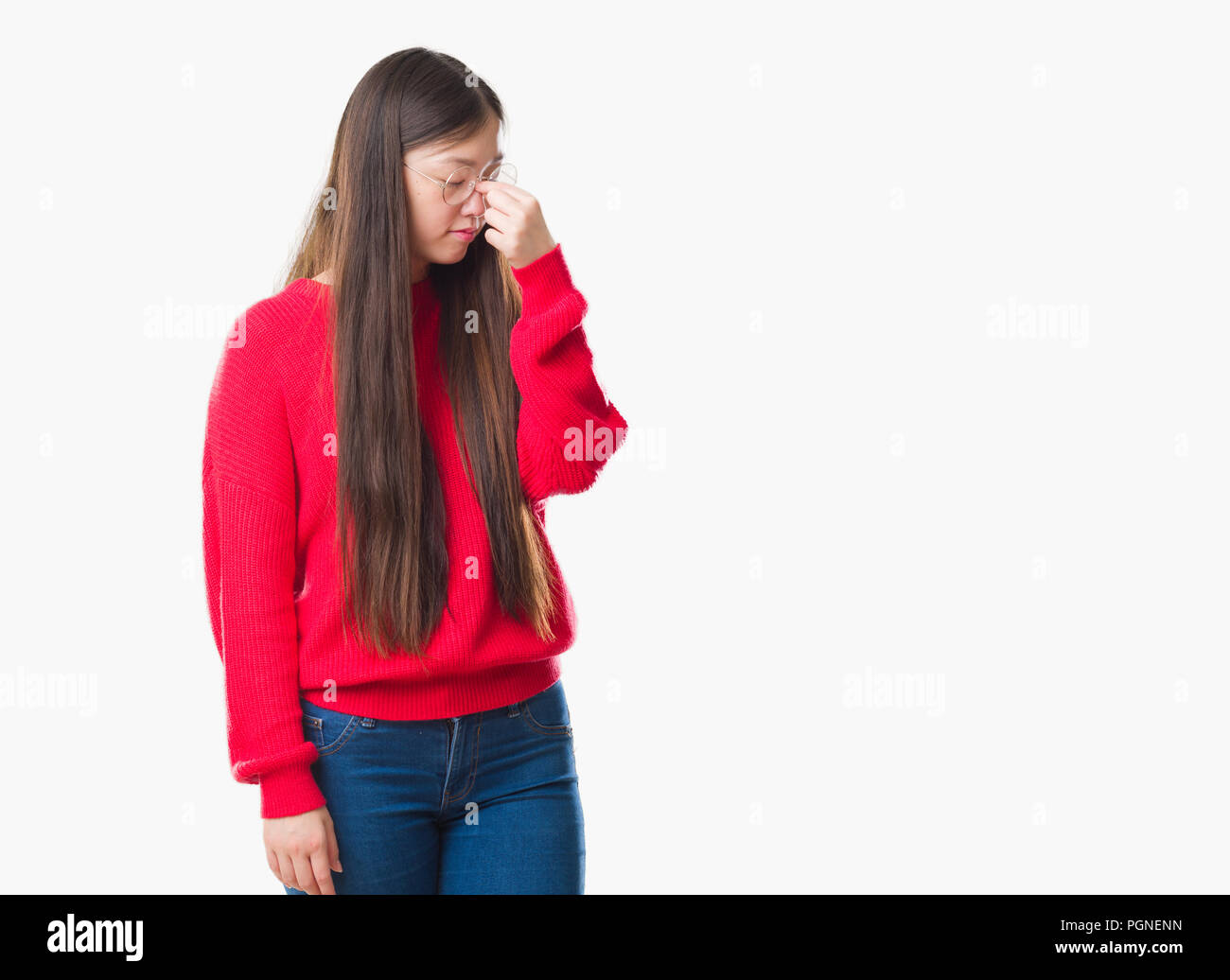 Young Chinese woman over isolated background wearing glasses tired