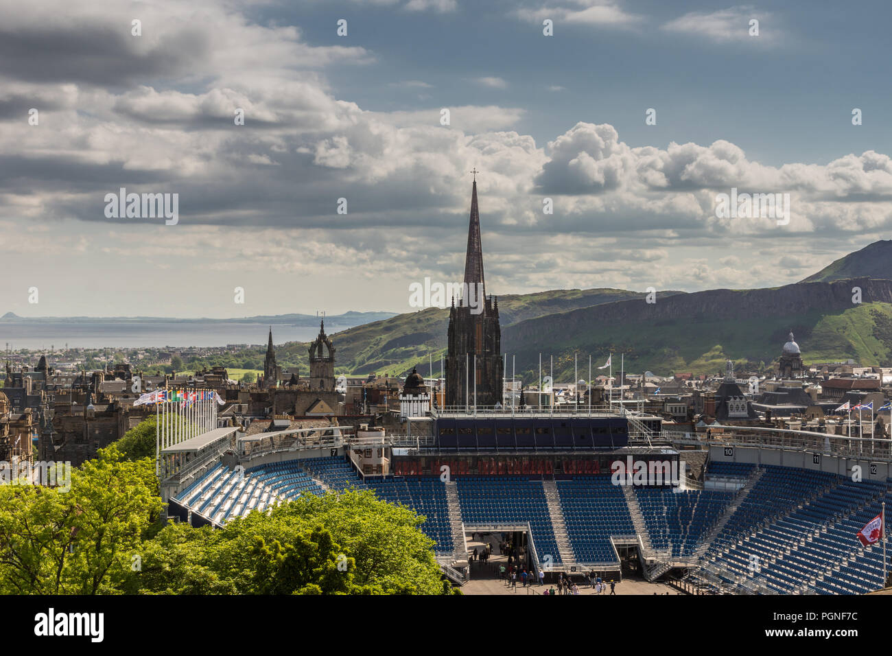 Edinburgh, Scotland, UK - June 14, 2012: Wide view from top of castle over esplanade show grounds towards Royal mile with towers and the sea in the di Stock Photo
