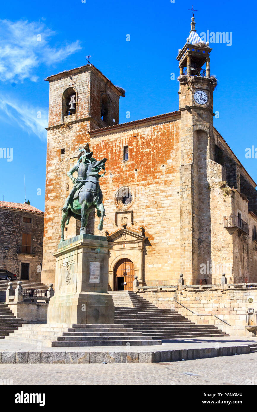 Statue of Francisco Pizzaro on horse and the Roman Catholic church of San Martin, Trujillo, Spain Stock Photo