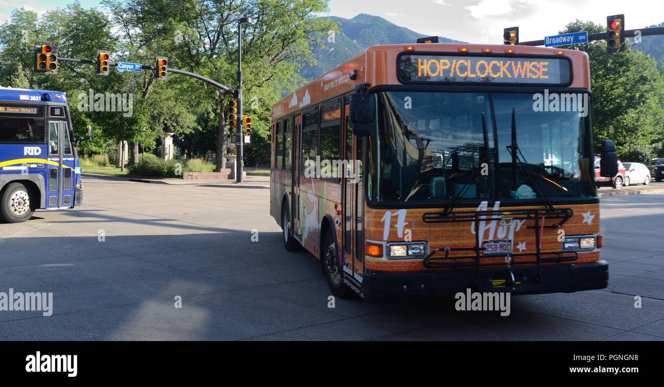 The 'Hop' makes a turn from Canyon Blvd. onto Broadway St. in Boulder, Colorado. Stock Photo