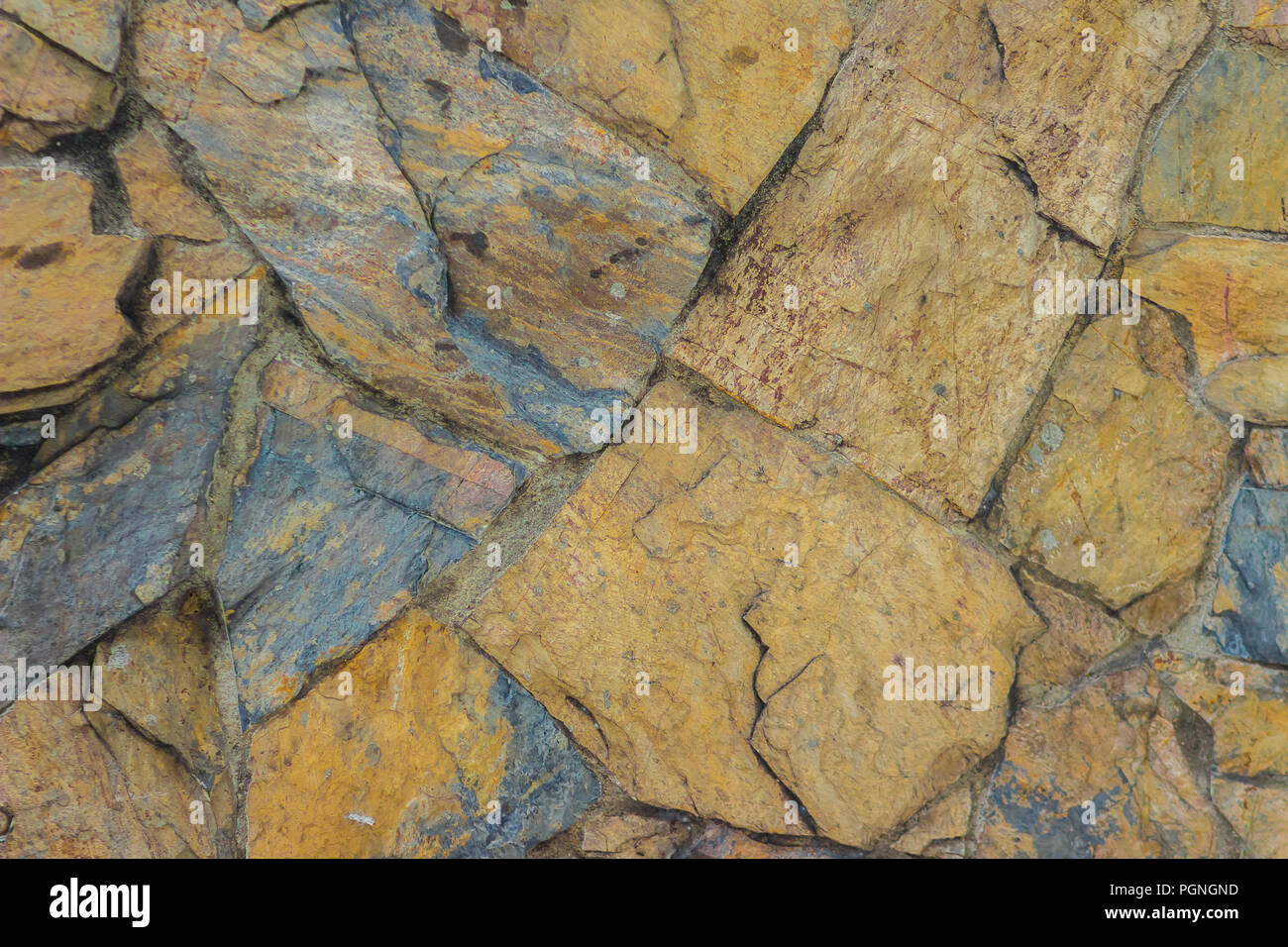 Exotic pattern of decorate slate stone wall background. Abstract