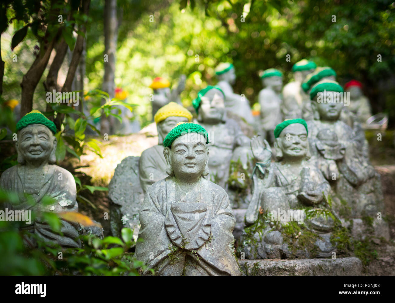 Statues of the original followers of Buddha (called Shaka Nyorai in Japan), with knitted caps at Daisho-in Temple (Daishoin Temple), Miyajima, Japan. Stock Photo