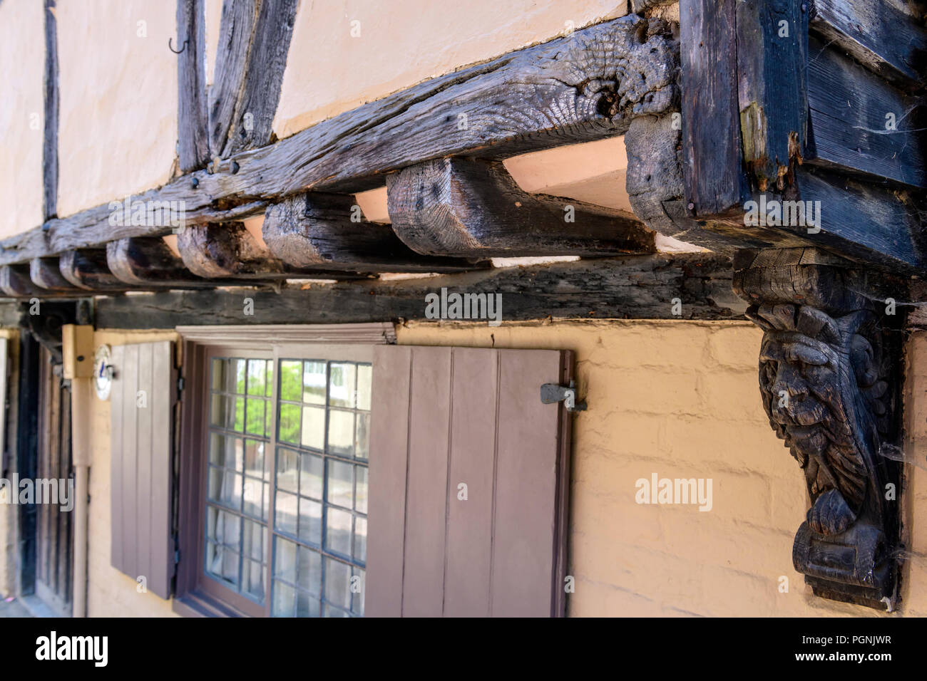 Detail of the overhang and corbels of a 16th century timber framed house Stock Photo