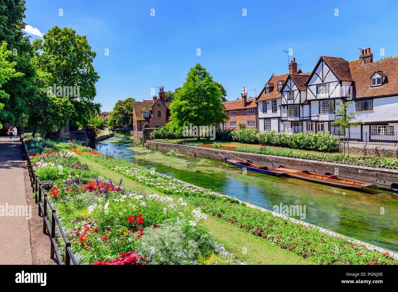 punts moored on the great stour river in front of timber framed houses of westgate grove Canterbury Stock Photo