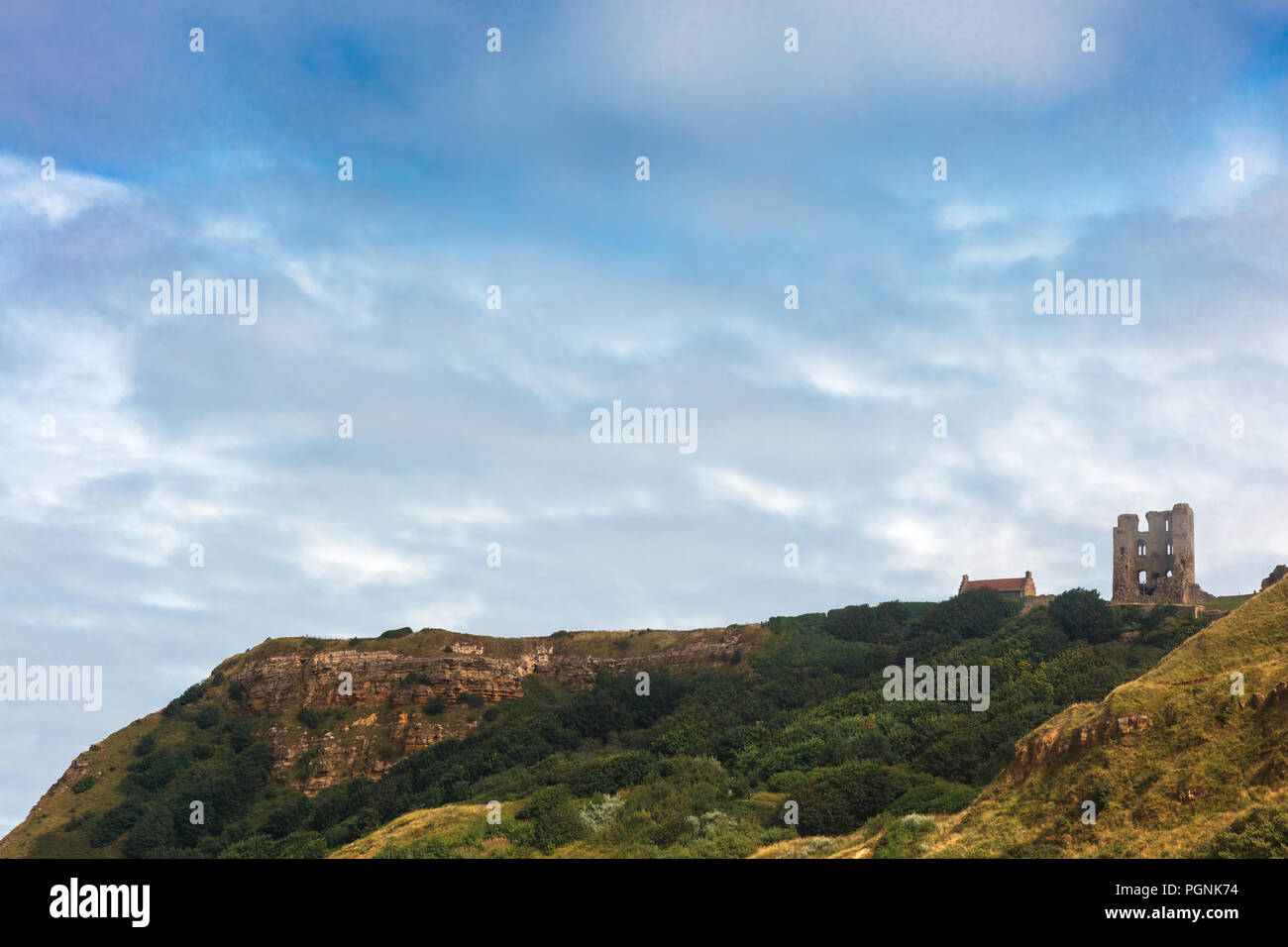 Dramatic cliff side landscape with Scarborough Castle in North Yorkshire. Stock Photo
