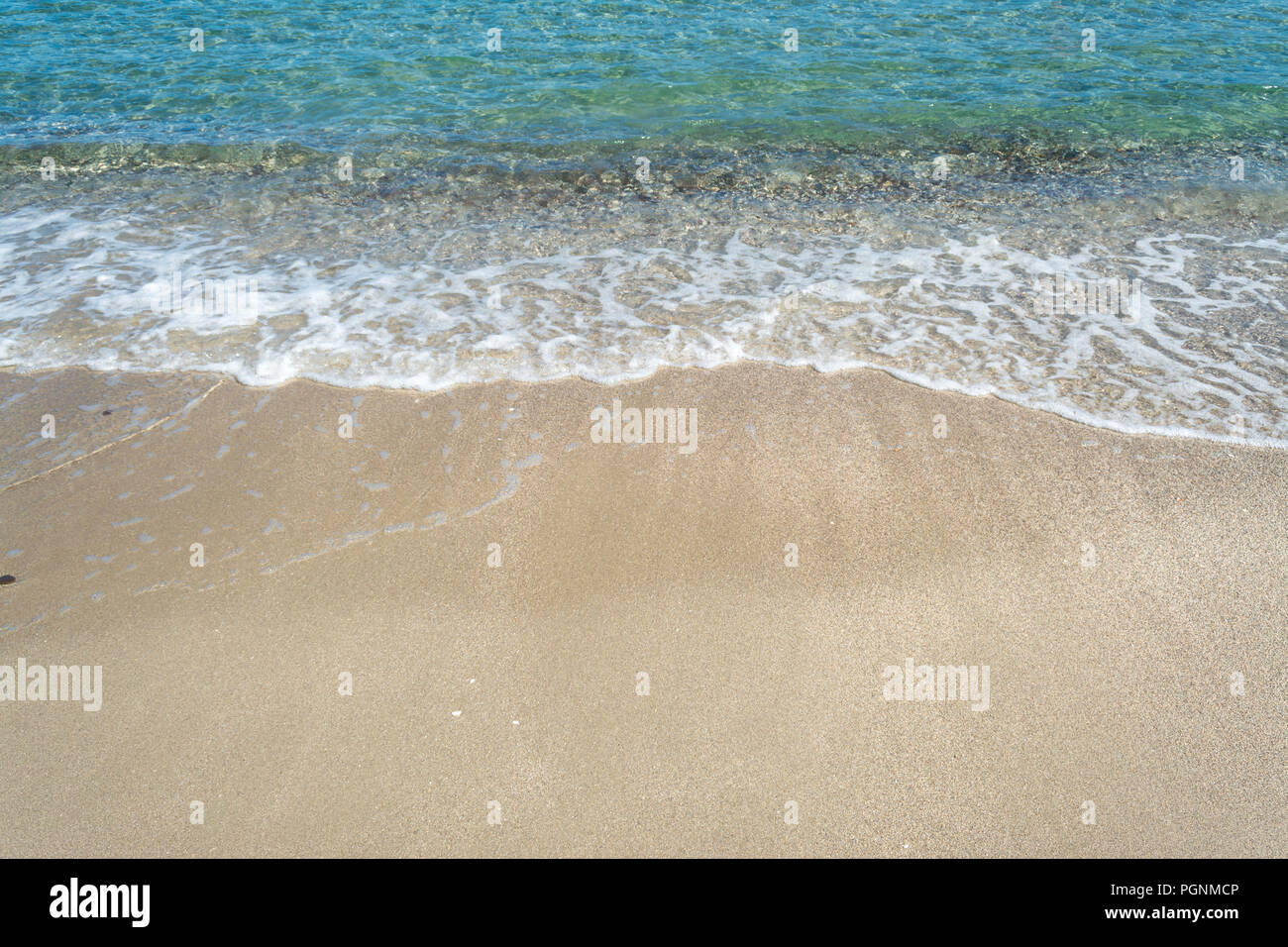 sea water foam on the beach in a sunny day of summer Stock Photo - Alamy