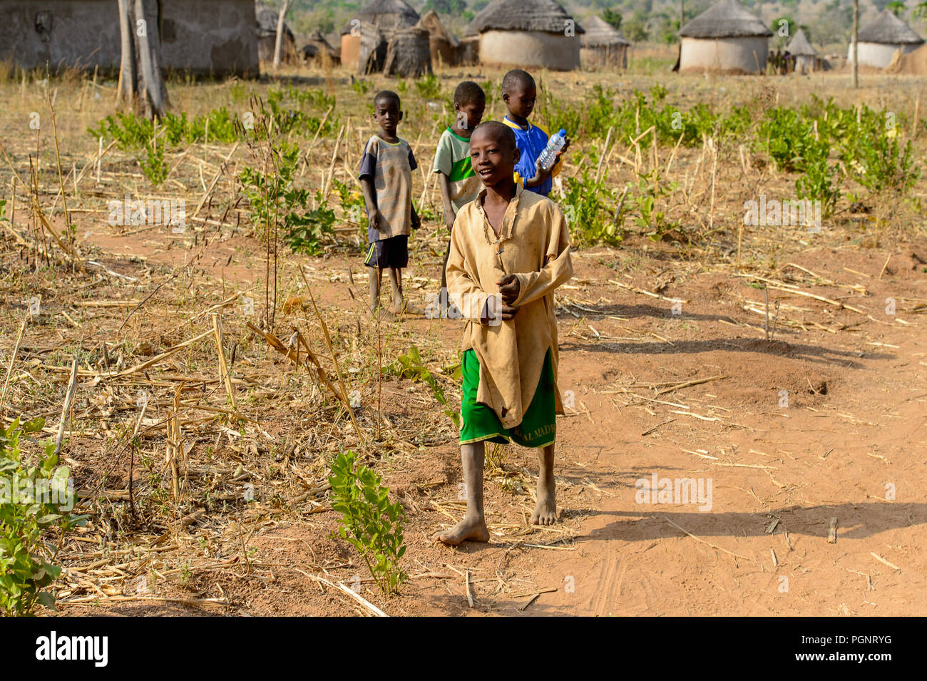 GHANI, GHANA - JAN 14, 2017: Unidentified Ghanaian children walk in the Ghani village. Ghana children suffer of poverty due to the bad economy. Stock Photo