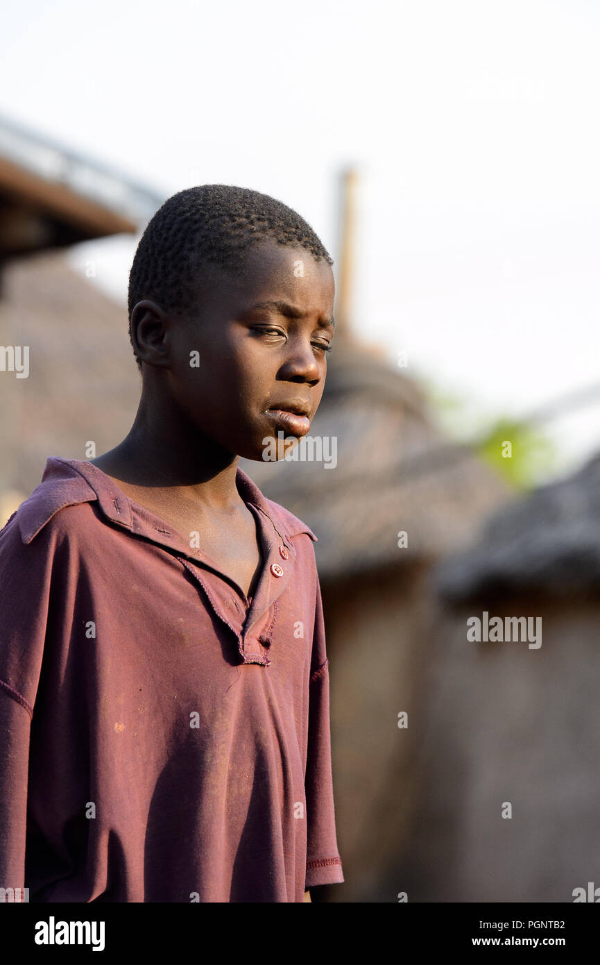 Tagombaw DAGOMBA VILLAGE, GHANA - JAN 14, 2017: Unidentified Dagomban boy walks ...