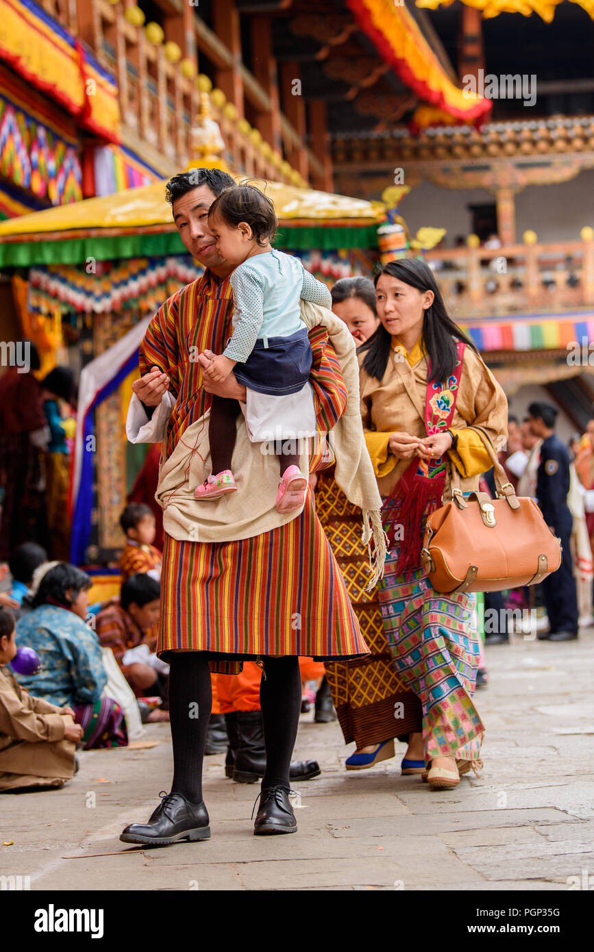 TRIMPHU, BHUTAN - MAR 8, 2017: Unidentified Ngalops people walk in the