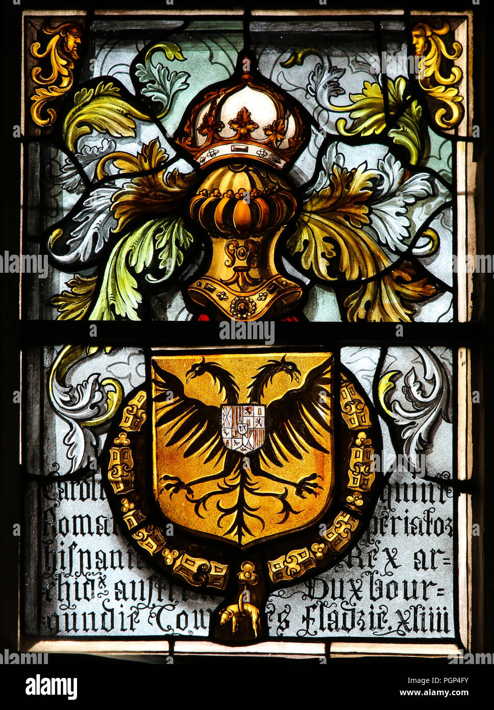 Stained Glass in the Basilica of the Holy Blood in Bruges, Belgium, depicting the Double-headed eagle or Imperial Eagle, Coat of Arms of the Holy Roma Stock Photo