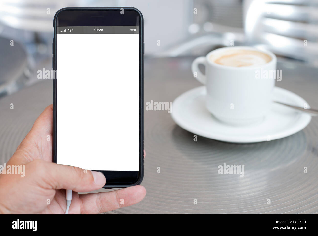 smartphone with blank screen on coffee table Stock Photo - Alamy